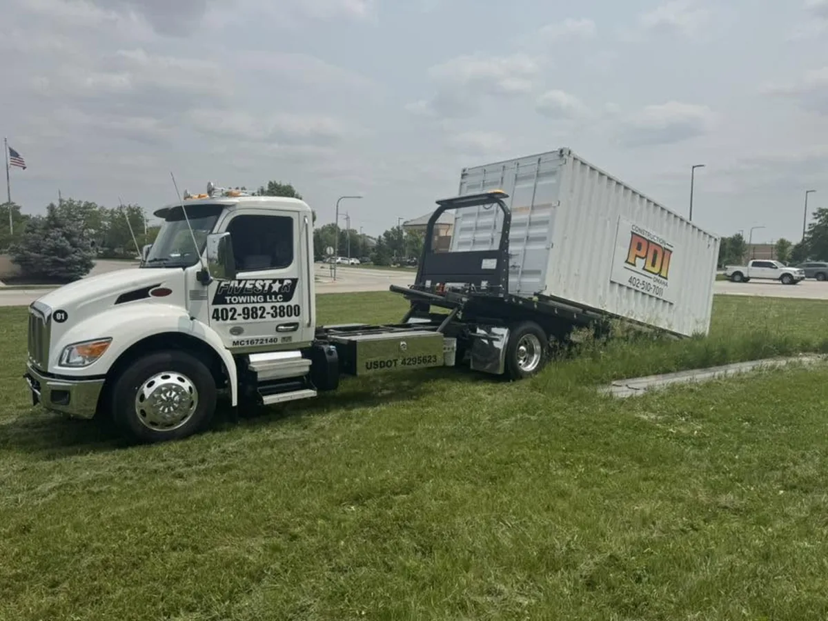 Carrying a white shipping container